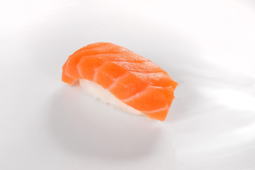 Sushi with salmon on a white background.