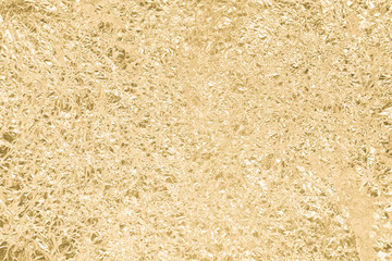 Gold wrinkled paper texture abstract background