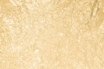 Gold wrinkled paper texture abstract background