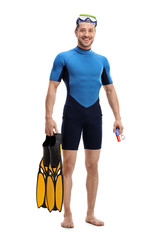 Guy in a wetsuit with snorkeling equipment