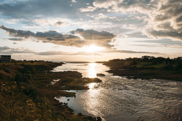 breathtaking scenery of a sunset and a sea shore