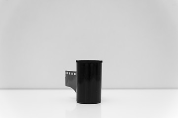 Photographic film roll behind the plastic canister