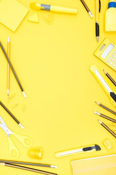 Flat Lay Of Yellow Office Supplies, Calculator And Pencils With Copy Space On Yellow