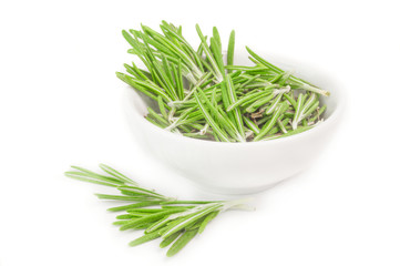 Fresh rosemary in a bowl on white