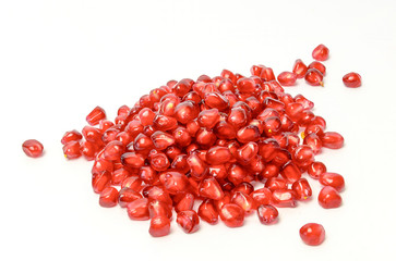 Scattered pomegranate seeds isolated on white background cutout