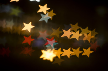 Abstract star shape bokeh background of town
