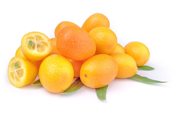 Pile of kumquat and two its half isolated on white background cutout with leaves