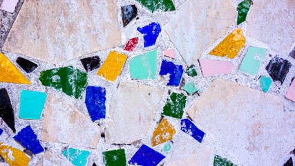 Colorful stone mosaic with chaotic pattern, seamless background texture