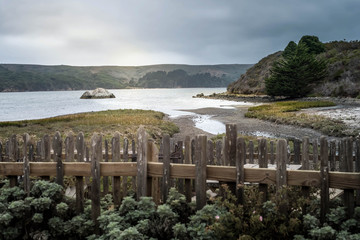  Tomales Bay California sunset with clouds and streaks of sun over the water