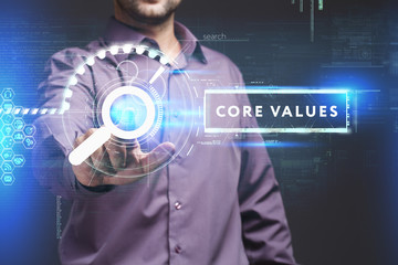 Business, Technology, Internet and network concept. Young businessman working on a virtual screen of the future and sees the inscription: Core values