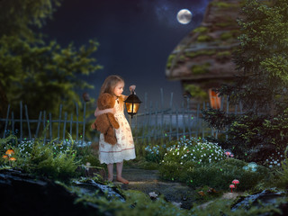 The little girl in the night in a beautiful magical forest. Girl holding an antique lantern and a...