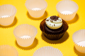 Birthday cupcake against a yellow background