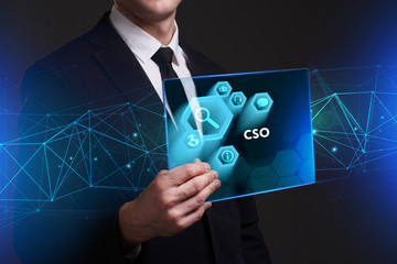 Business, Technology, Internet and network concept. Young businessman working on a virtual screen of the future and sees the inscription: CSO