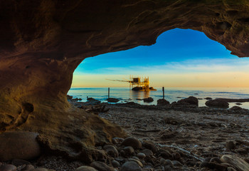 Naklejka premium Punta Aderci, Vasto - Trabocchi Coast in the Abruzzo region (Italy), wooden architecture on the sea at sunrise.