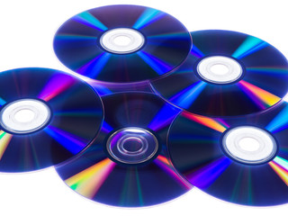 CDs with colorful reflections on white isolated background