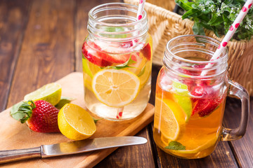 Fototapeta na wymiar Fresh lemonade with strawberries and lime