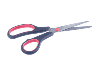 Open steel schissors with black and red handle on white ioslated background