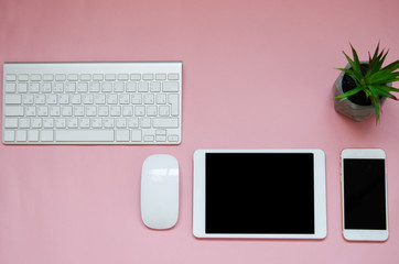 white devices on pink background. mock up