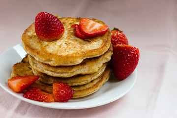 Stack of homemade wholegrain buckwheat pancakes. Individually fried on pan, thus imperfect shape