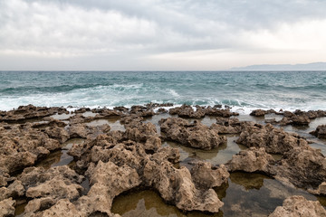 Mediterranean Sea waves breaking rocky coastline of Cyprus island