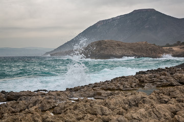 Mediterranean Sea waves breaking rocky coastline of Cyprus island