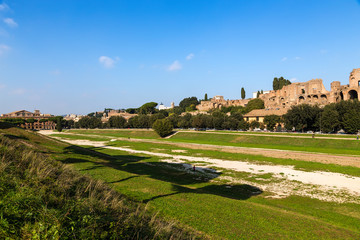 Fototapeta na wymiar Rome, Italy. The Large Circus (Circus Maximus) and the ruins of the imperial palaces on Palatine Hill.