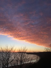 Fototapeta na wymiar North Sea coast at dawn. Rosy fingered dawn. Scarborough, North Yorkshire, Enland