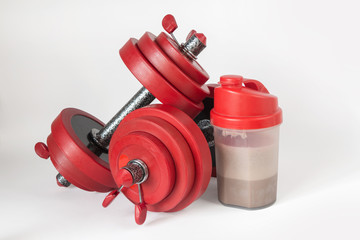 Dumbbells and shaker with whey protein, fitness lifestyle concept