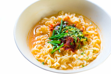 Instant noodles with  onion in a bowl, Asian meal on white background