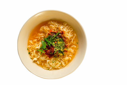 Instant noodles with  onion in a bowl, Asian meal on white background