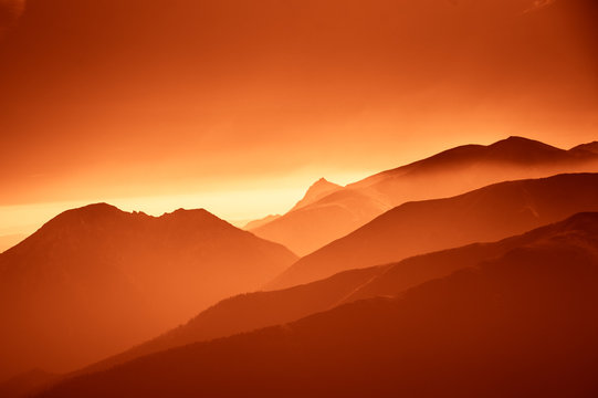 A Beautiful, Colorful, Abstract Mountain Landscape In A Red Tonality. Decorative, Artistic Look.