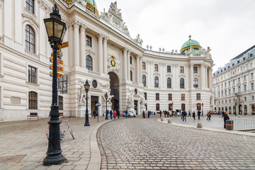 Cloudy view of Hofburg Palace at Michaelerplatz, Habsburg Empire landmark in Vienna, Austria.