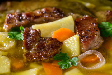 Soap with meat, potato and carrots, close-up