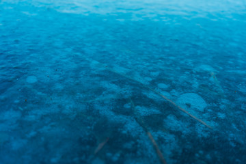 icy water of an blue lake in winter
