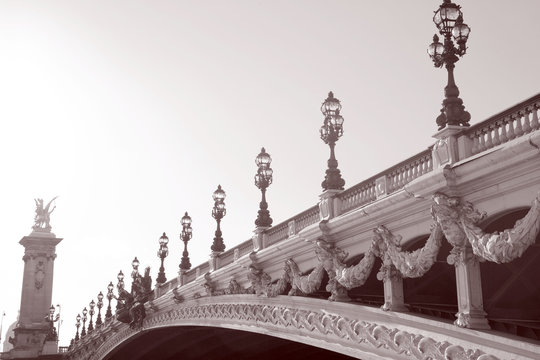 Fototapeta Pont Alexandre III Bridge in Black and White Sepia Tone in Paris, France