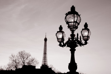 Illuminated Lamppost on Pont Alexandre III Bridge with the Eiffel Tower in the background in Paris; France