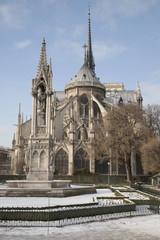 Fototapeta na wymiar Notre Dame Cathedral Church in the Snow in Winter in Paris, France