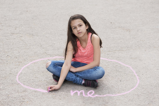 Girl Sitting On The Ground And Drawing Personal Space