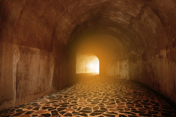 Tunnel with light coming from the exit. - Powered by Adobe