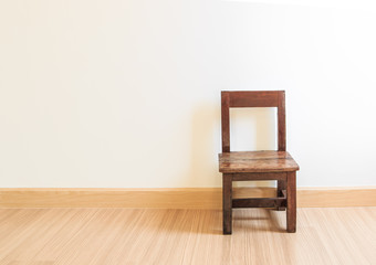 Old wooden chair on the laminate floor