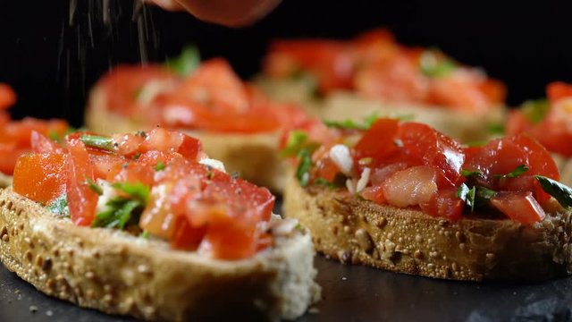 Classic Italian bruschetta, tomato, garlic and parsley on toasted bread