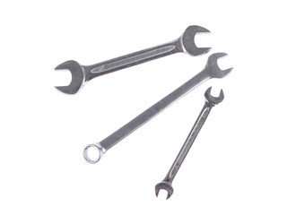Three different steel spanners over white isolated background