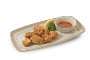 Isolated and clipping path of deep fried chicken with chilli sauce.