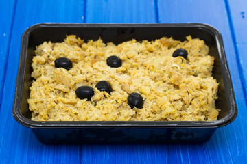 portuguese dish cod fish with potato and eggs on dish