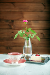 A cup of hot tea and cake. The concept of drinks and food.
