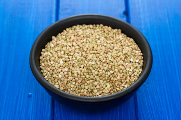 green buckwheat in black bowl