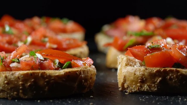 Classic Italian bruschetta, tomato, garlic and parsley on toasted bread
