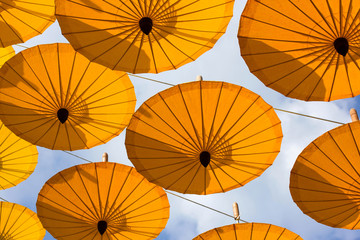 many decoration with hanging yellow umbrella outdoor