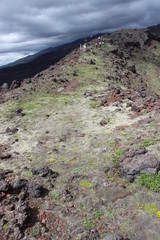 Black and red ash, valley of hills, after volcanic eruption