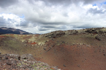 Black and red ash, valley of hills, after volcanic eruption